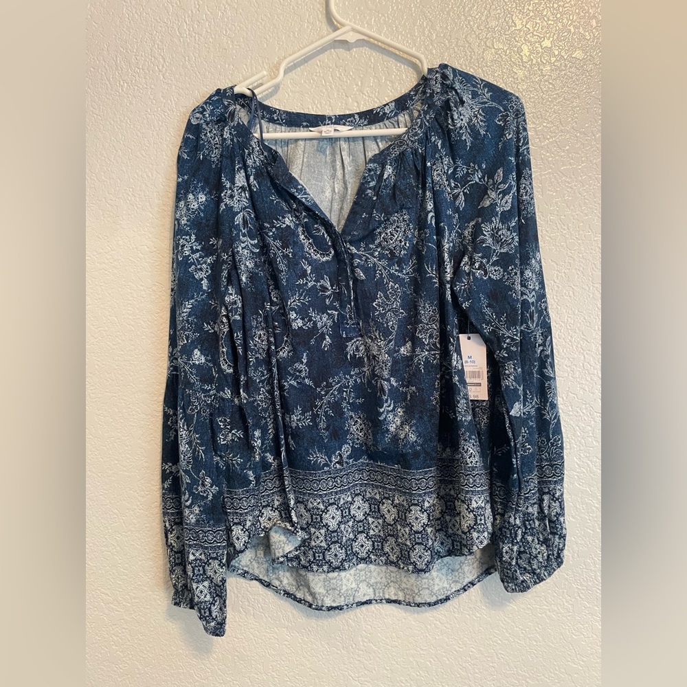 Blue long sleeve shirt, white design, flowy, v-neck line